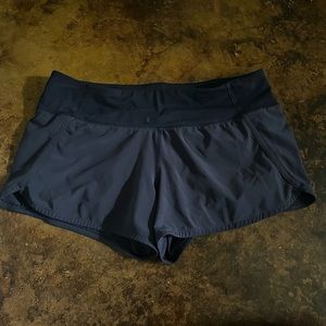Lululemon Midrise Run Times 4 inch - True Navy Size 10 - white stain on band
